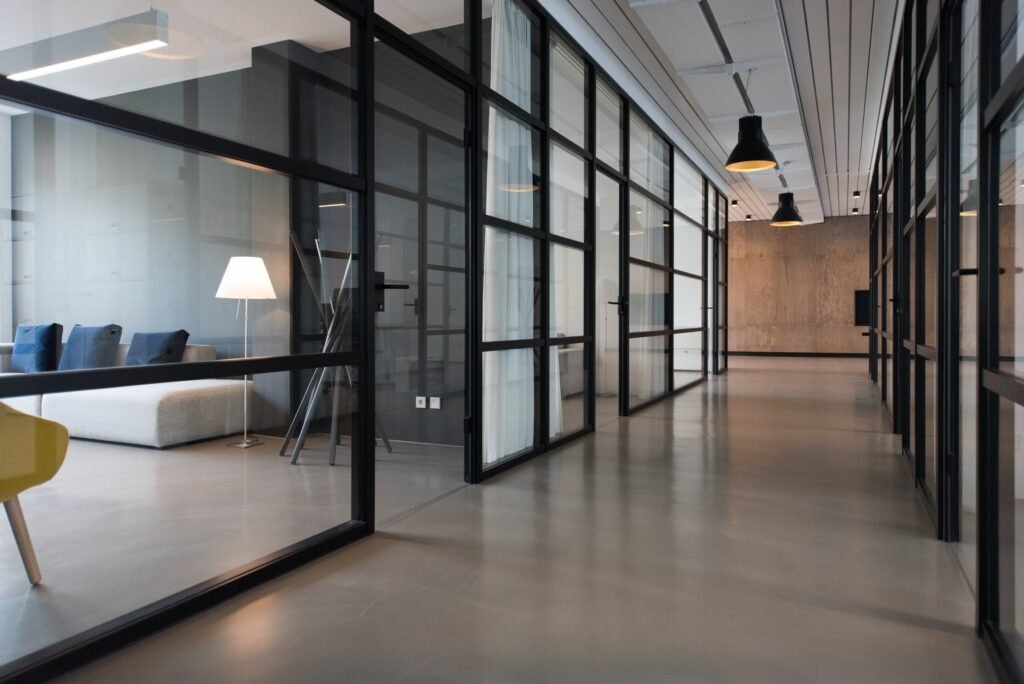 an office with windows in a hallway