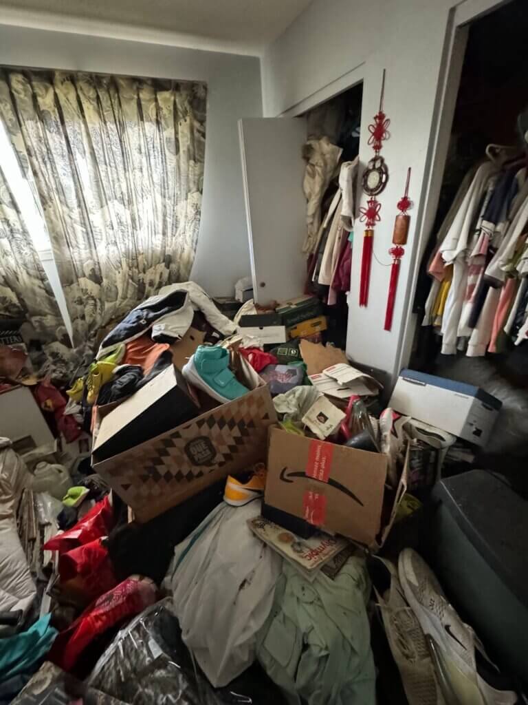 Hording in bedroom before filthy masters cleanout and biohazard cleaning