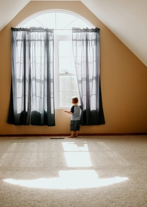 a child looking out of a window